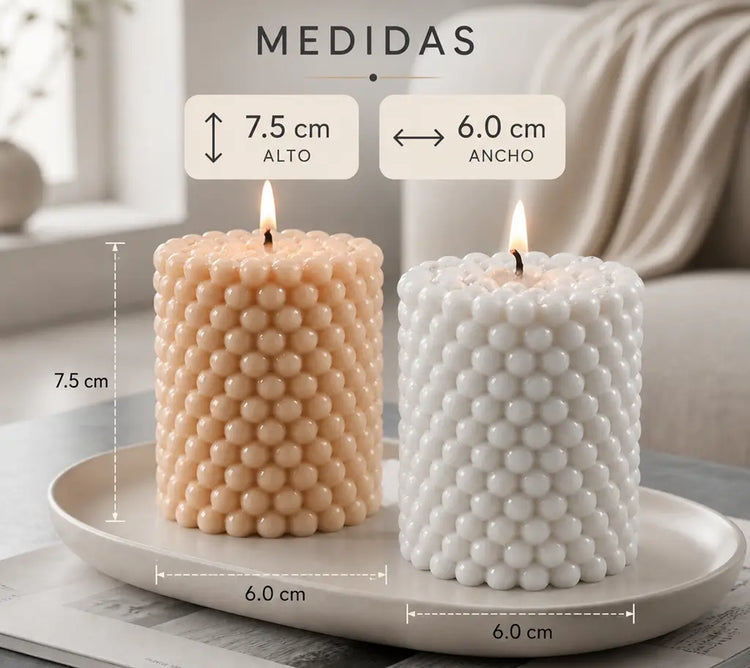Vela Perla Serenity con diseño bubble elegante en color blanco, encendida, sobre una bandeja, ideal para decoración moderna y ambientes relajantes.