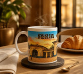 Taza blanca de cerámica con ilustración artística del recinto ferial de Albacete al atardecer, con el texto "FERIA ALBACETE", ideal como souvenir.
